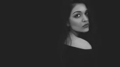 A captivating black and white portrait highlighting the elegance and beauty of a woman with a mysterious gaze.
