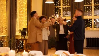 Joyous family celebration indoors with sparklers and festive lights.