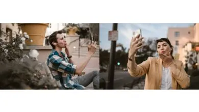A couple sharing a virtual kiss via smartphones, highlighting long-distance love and connection.