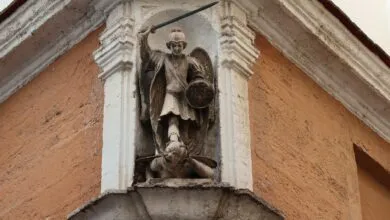 Detailed view of St. Michael Archangel statue on a historic building in C&aacute;diz, Spain.